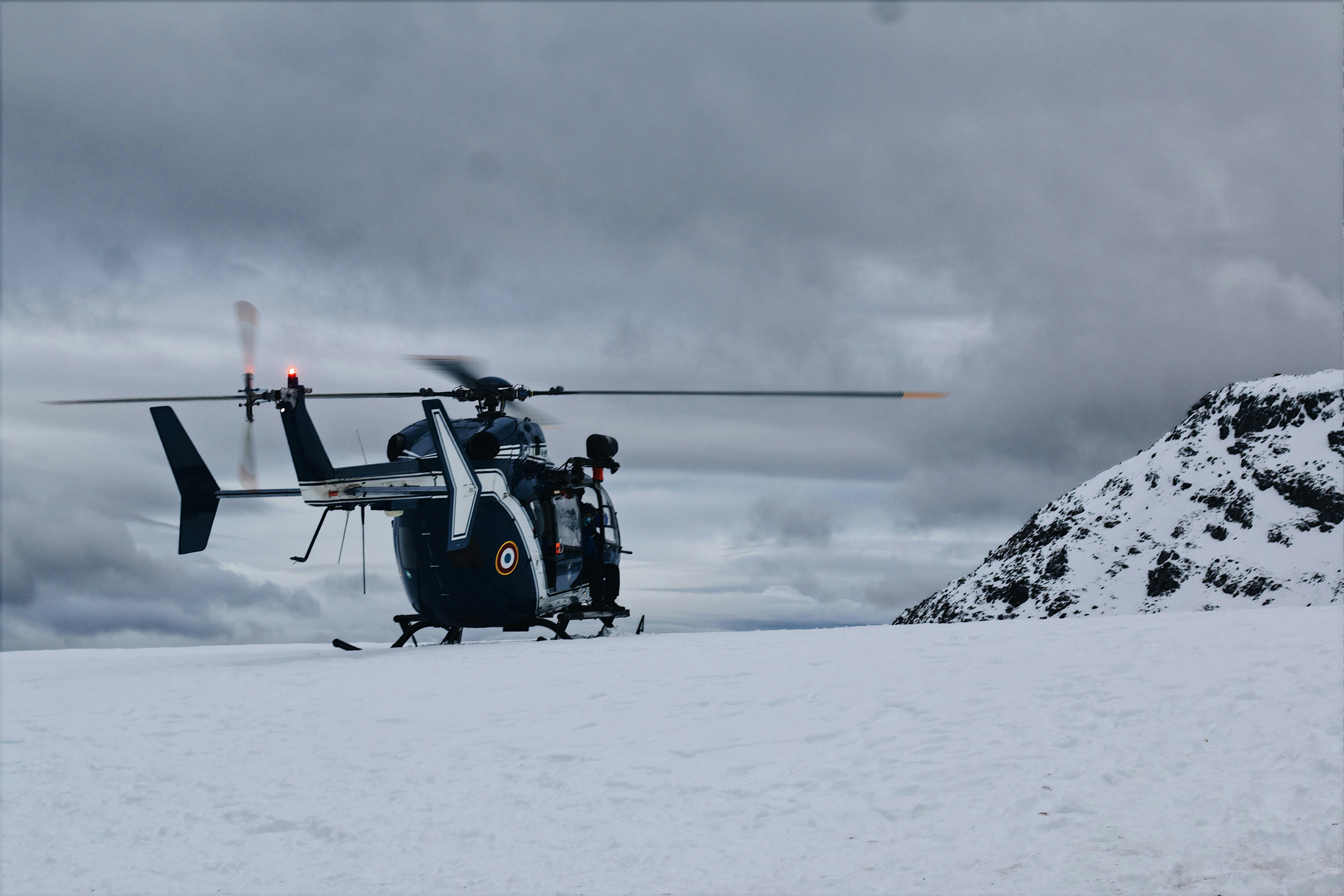 Helicopter operating in snowy mountain environment