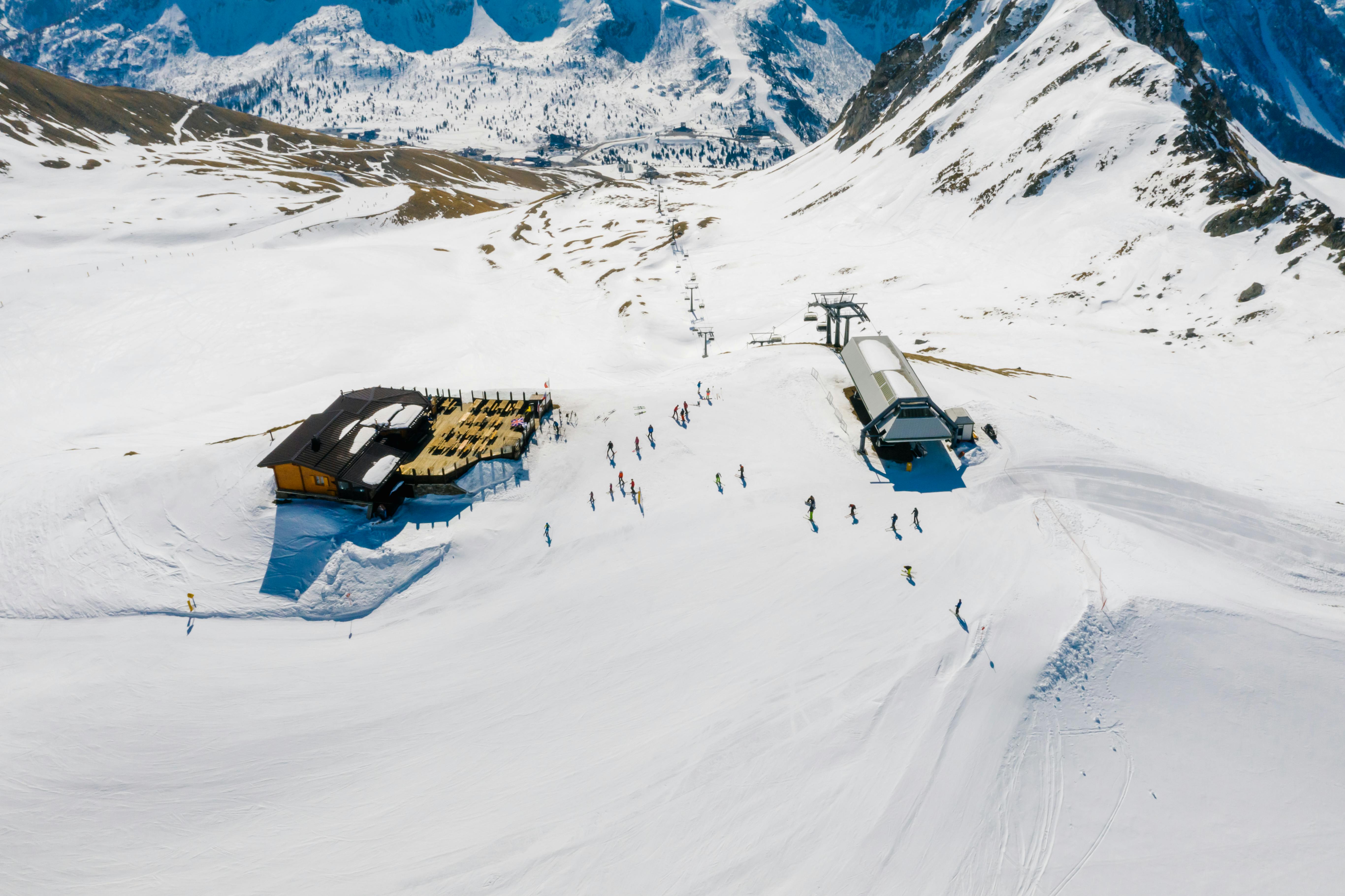 Snowy mountain resort terrain from above